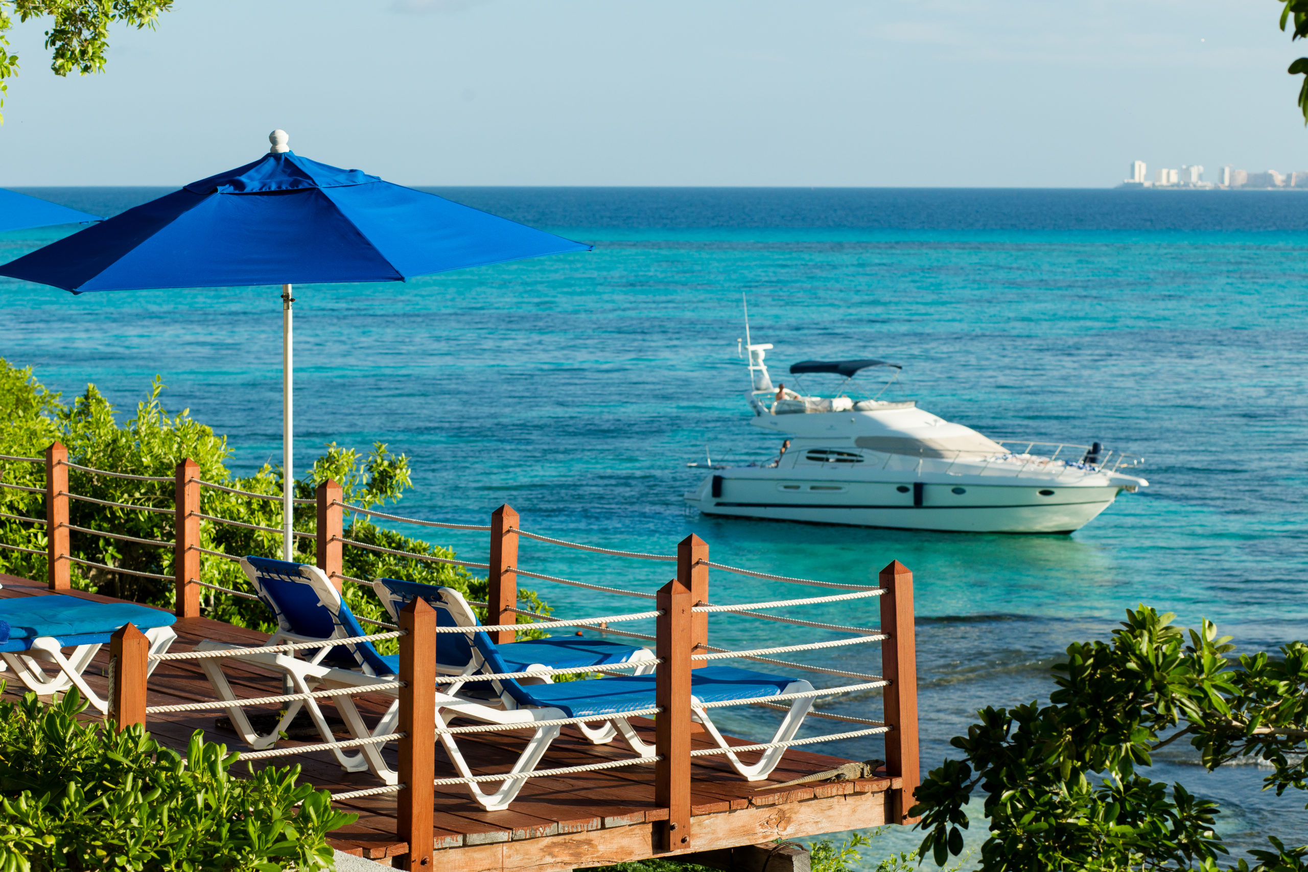 caribbean ocean from hotel la joya pool view with white boat